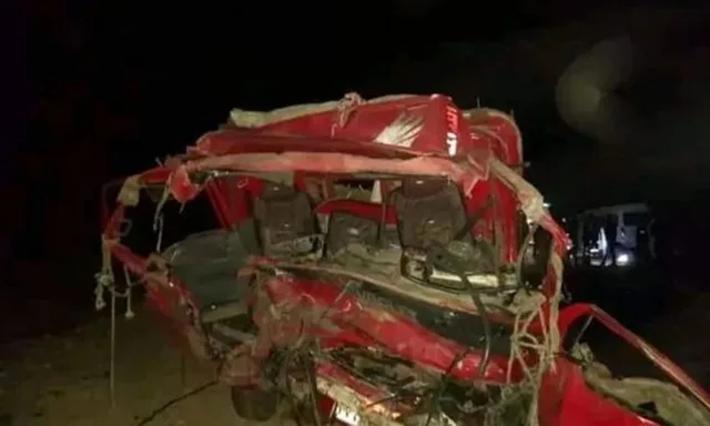 Wreckage of a red bus after an earlier road crash in Egypt at night, file photo