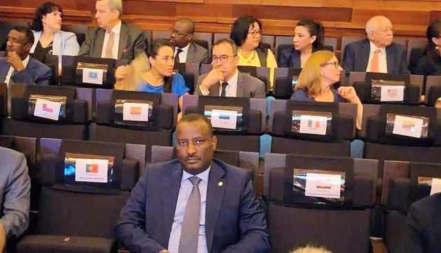 Mauritania's Justice Minister Mohamed Ould Soueidatt seated in an international conference hall