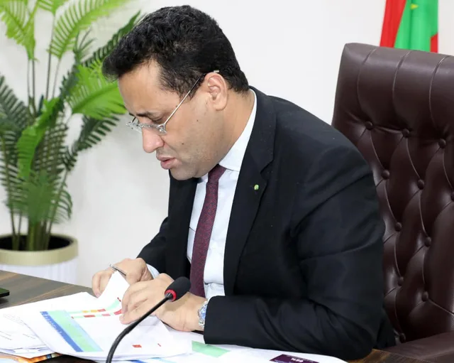 Prime Minister El Moctar Ould Djay reviews documents in his office