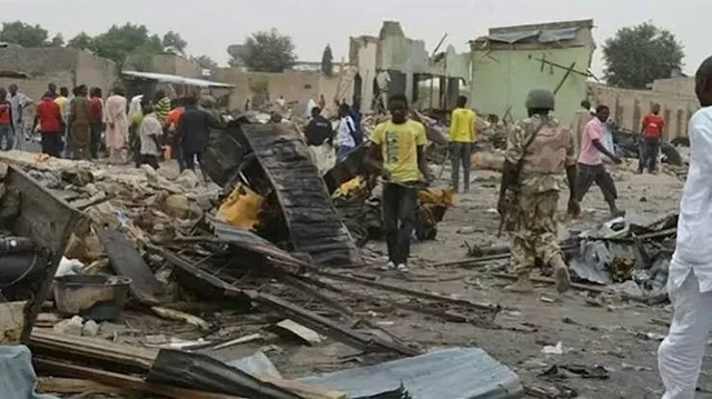 Soldiers and residents among debris and destroyed buildings