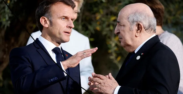 French President Emmanuel Macron speaking with Algerian President Abdelmadjid Tebboune