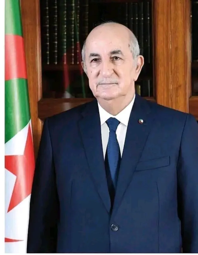 Official portrait of Algerian President Abdelmadjid Tebboune in front of the Algerian flag