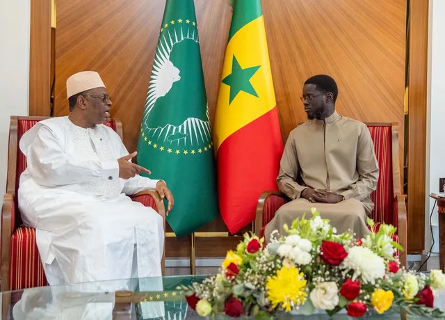 Former Senegalese president Macky Sall talks with President Bassirou Diomaye Faye at the presidential palace in Dakar, file photo