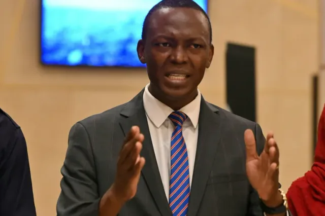 Succes Masra speaking and gesturing with his hands