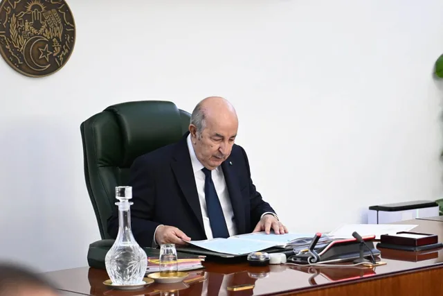 Algerian President Abdelmadjid Tebboune reading documents at his desk, file photo
