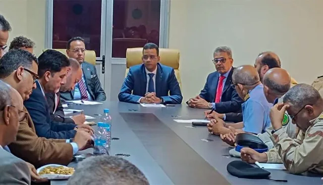 Officials around a meeting table