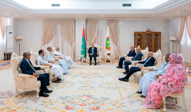 President Mohamed Ould Cheikh El Ghazouani seated in a formal reception room at the presidential palace with a delegation of political figures