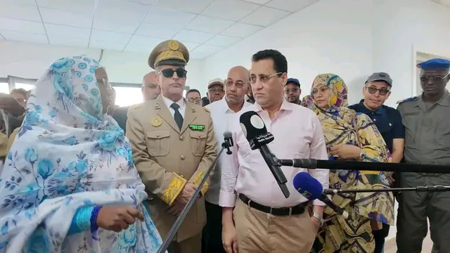 The prime minister speaking to the press during a visit to a health facility