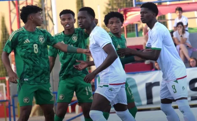 Mauritanian youth players in white mark Saudi players in green at a set piece, file photo