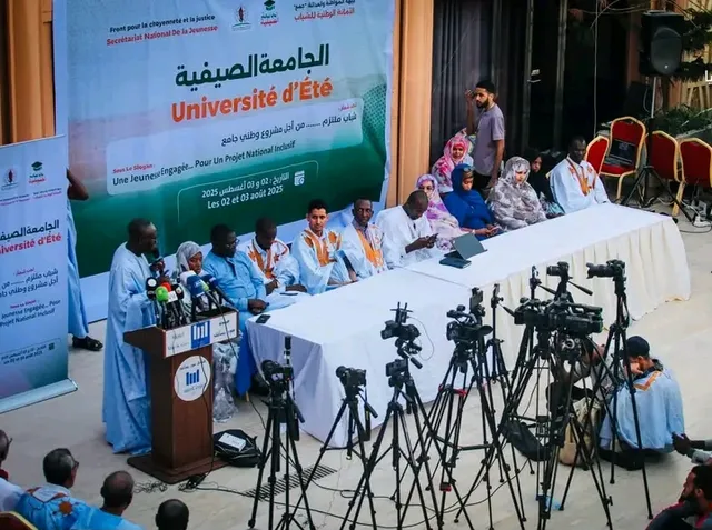 FCJ youth press conference in front of a summer university banner