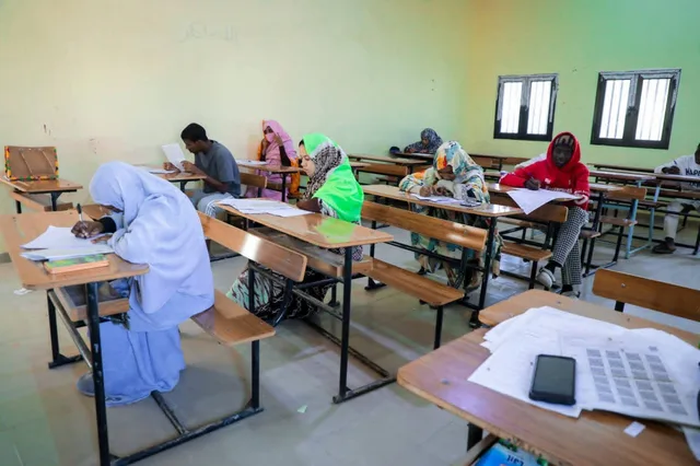 Students writing at their desks in a classroom