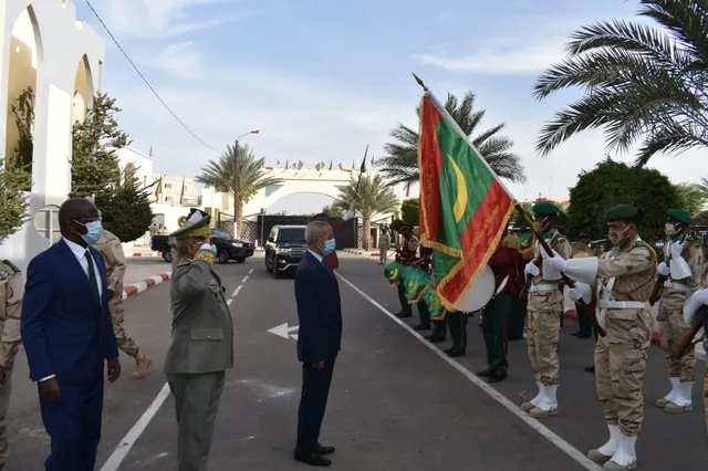 Soldiers carrying the Mauritanian flag during a ceremony at the armed forces general staff