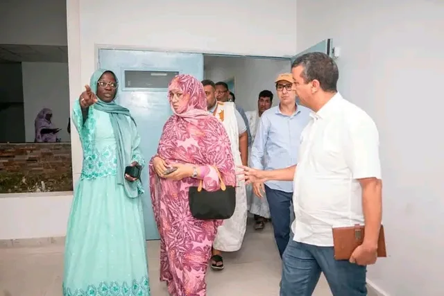 The health minister visits a new health centre with officials