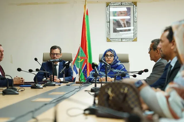 A minister and an ambassador at a meeting signing environmental funding in Nouakchott