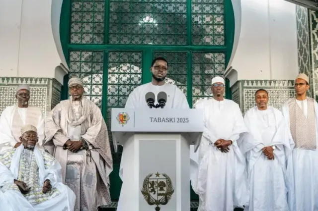 Senegalese President Bassirou Diomaye Faye speaking at a lectern alongside religious dignitaries, file photo