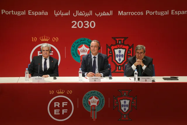 Fouzi Lekjaa seated at a news conference between the Spanish and Portuguese federation presidents