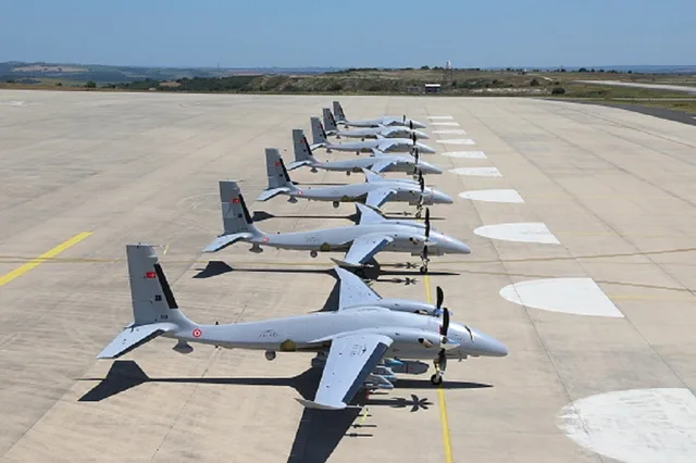 A row of Turkish military drones lined up on a runway, file photo