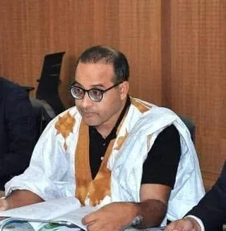 A member of parliament in a daraa at a meeting