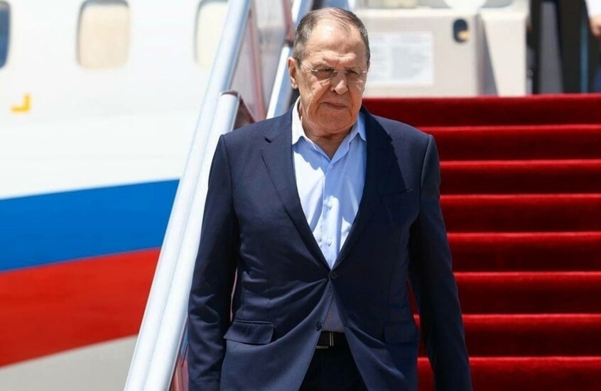 Russian Foreign Minister Sergey Lavrov steps off a plane onto a red carpet, file photo