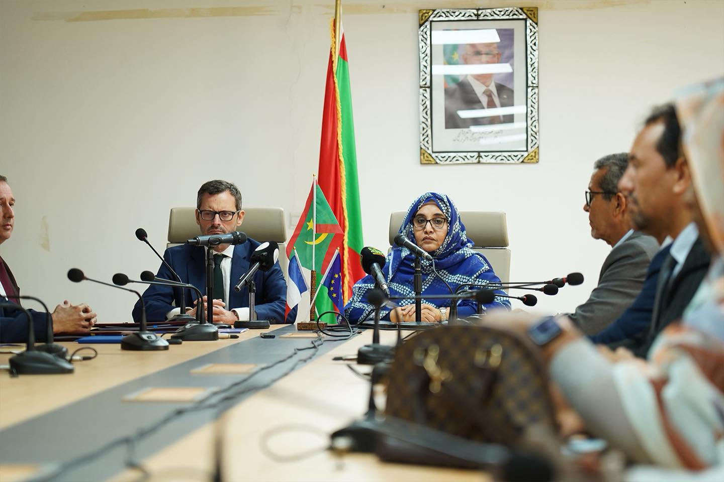 A minister and an ambassador at a meeting signing environmental funding in Nouakchott