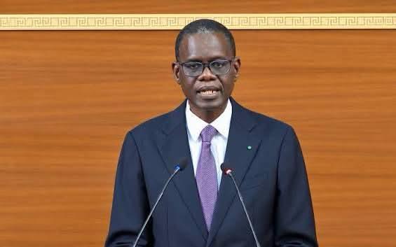 Senegalese Prime Minister Ahmadou Al Aminou Lo speaking at two microphones in parliament, file photo