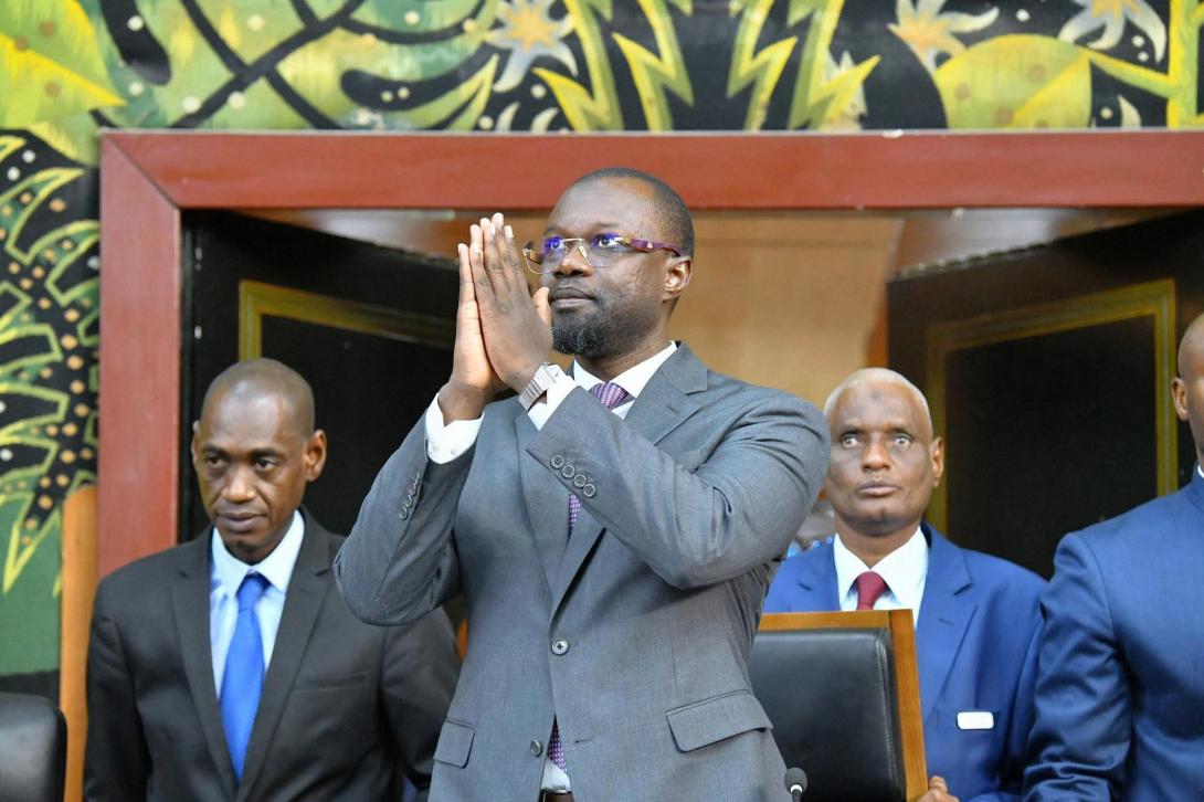 Ousmane Sonko greets with joined hands inside Senegal's National Assembly chamber