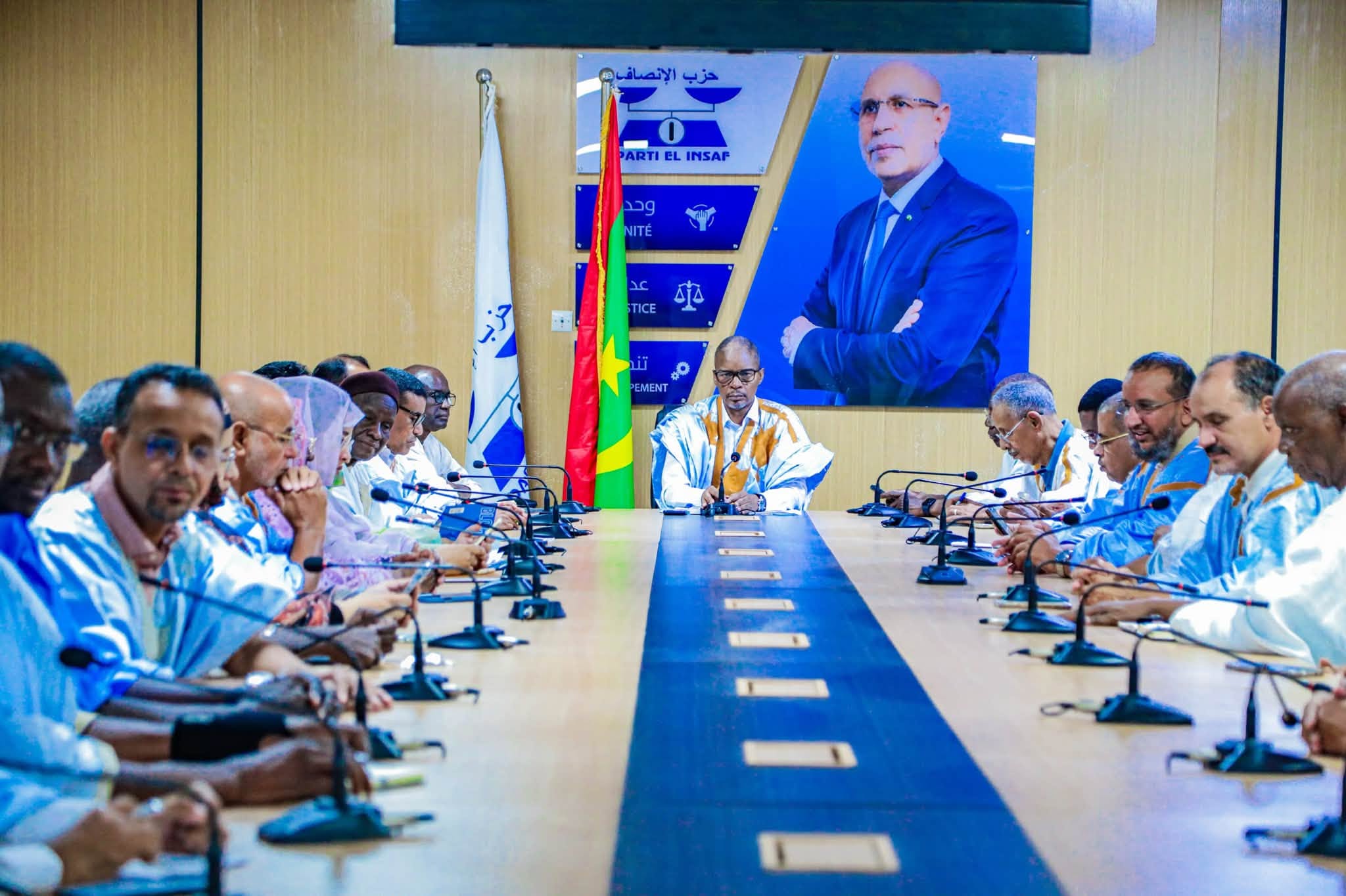 The El Insaf party president chairs a meeting with MPs around a long table at the party headquarters