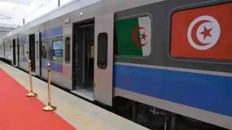 Train carriage bearing the Algerian and Tunisian flags at a station platform, file photo