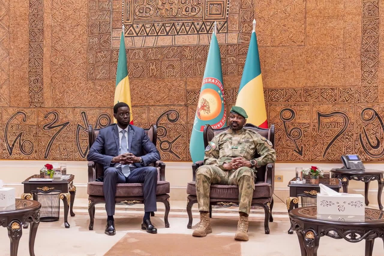 Senegalese President Bassirou Diomaye Faye and Mali's transitional president Assimi Goita seated before the flags of Senegal, Mali and the AES, file photo