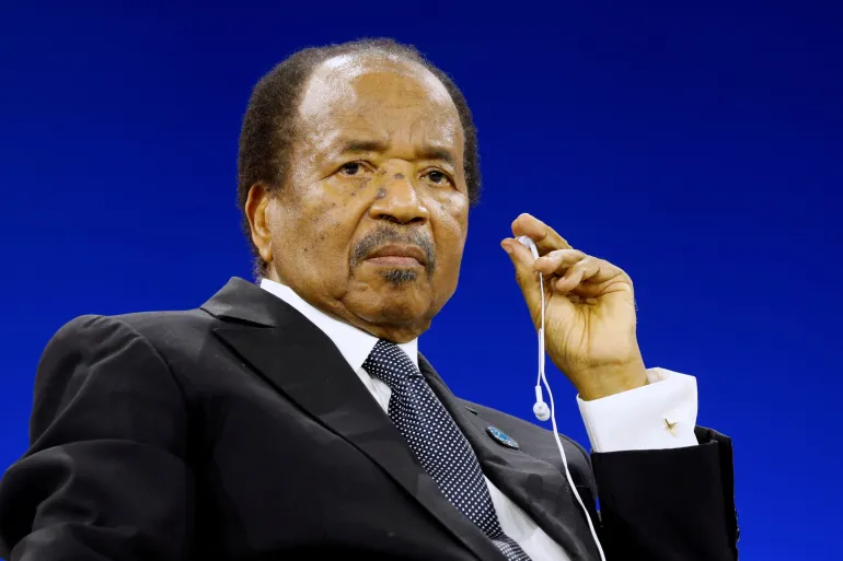 Cameroonian President Paul Biya wearing an interpretation earpiece