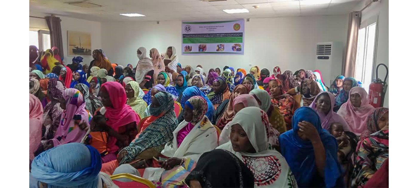 Women attend a workshop in a hall