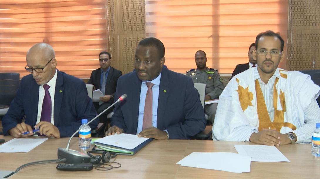 Members of parliament and the justice minister meeting in committee at the National Assembly