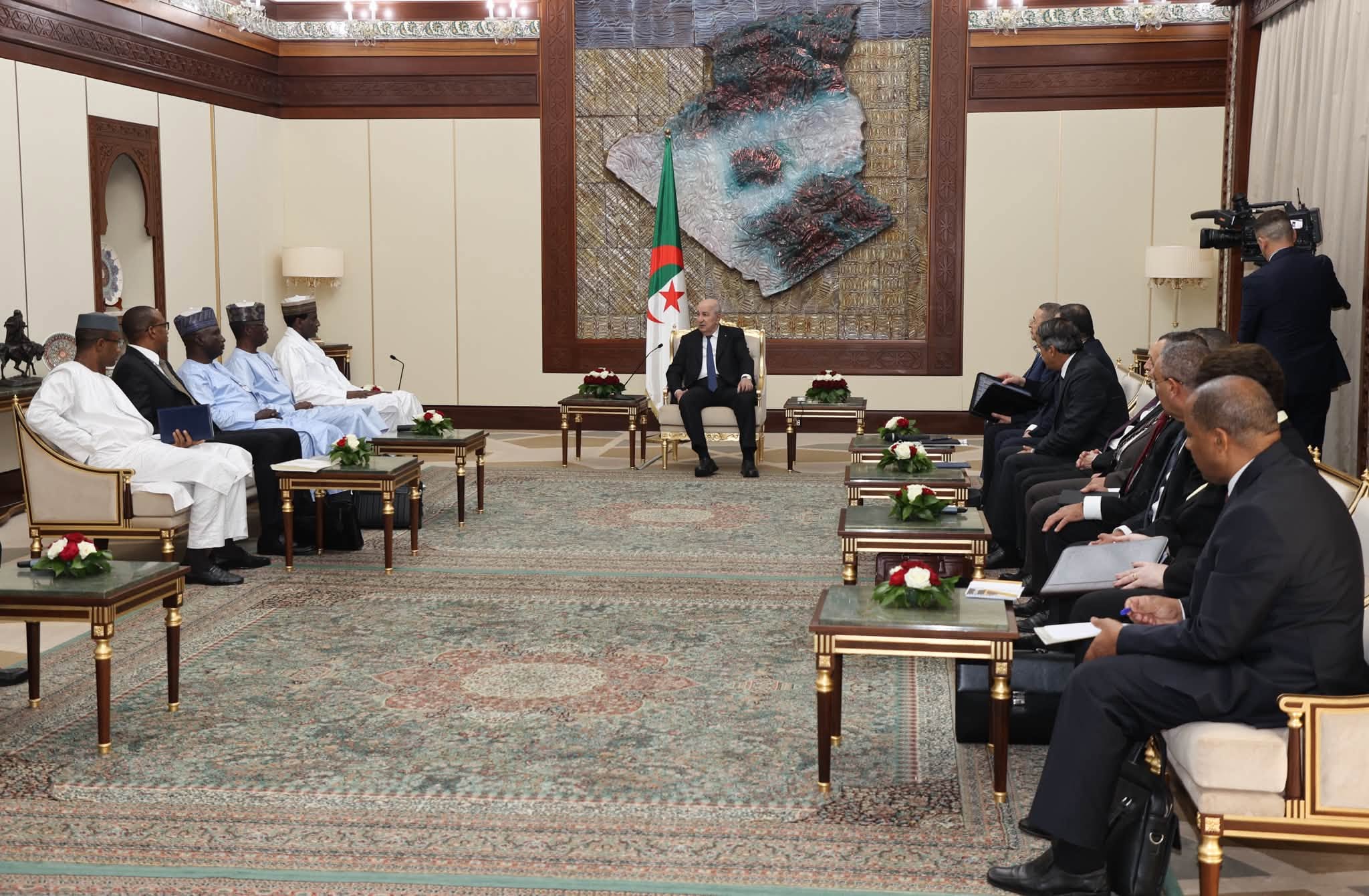 Algerian President Abdelmadjid Tebboune receives a Nigerien delegation in an official hall in Algiers, file photo