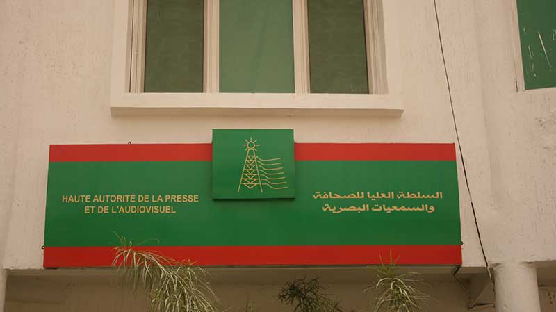 Sign of the High Authority for the Press and Audiovisual on its headquarters facade