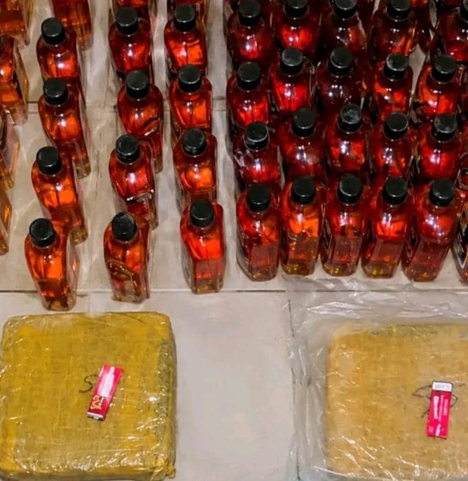 Bottles of alcohol and packages of drugs seized by the gendarmerie in Boghe