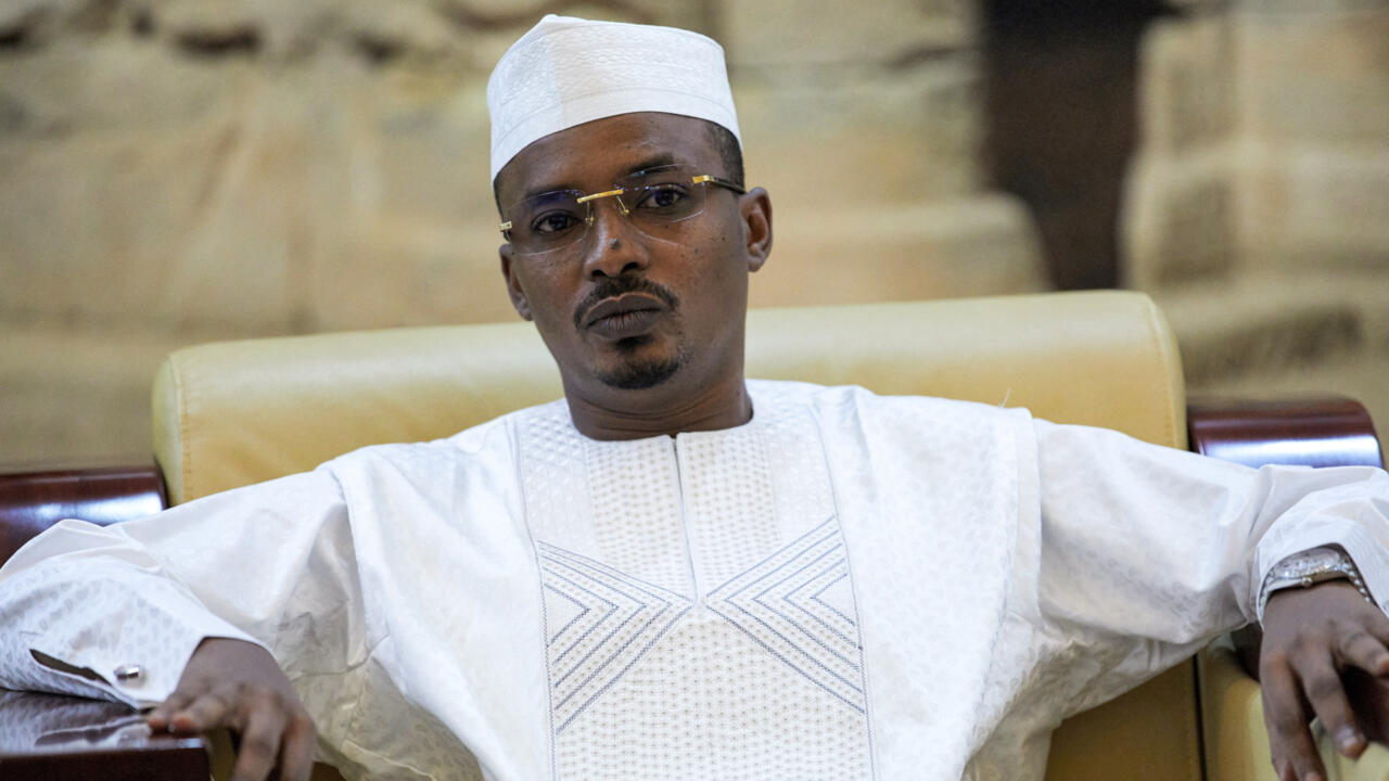 The Chadian president seated, dressed in white