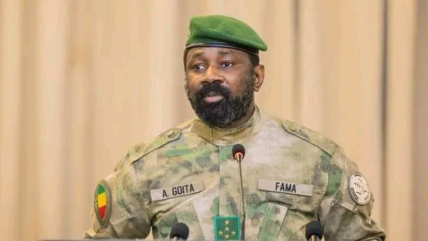 General Assimi Goïta in military uniform and green beret at a microphone, file photo